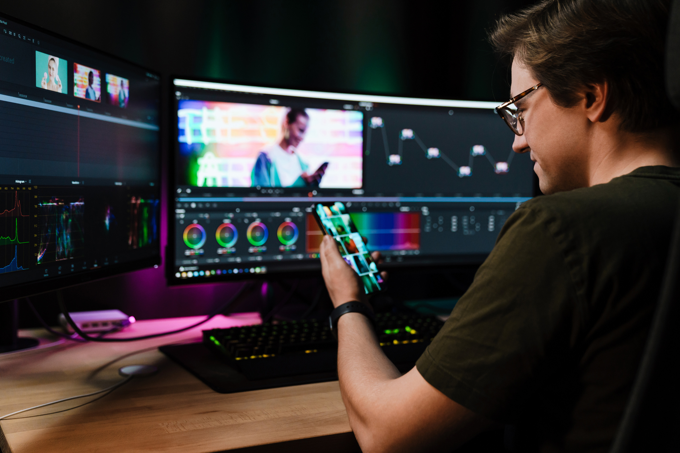 Back View of a Young White Man Video Editor